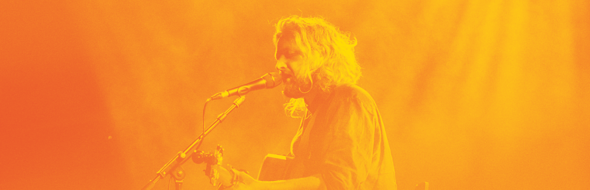 Will Varley playing guitar on stage