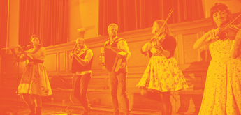 A folk band playing instruments on stage