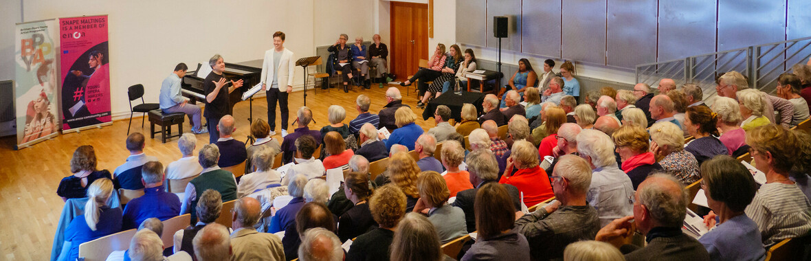 An audience watching a performance in the Recital Room