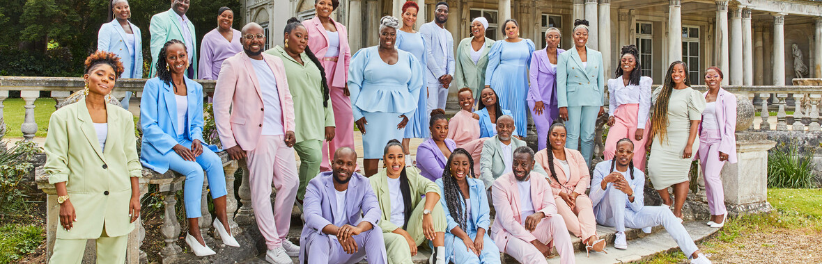 Kingdom Choir group shot in pastel outside venue