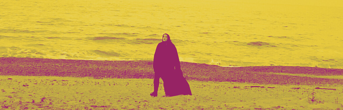 Laura Cannell walking on Dunwich Beach